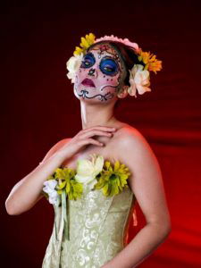 Woman with decorative makeup on her face.