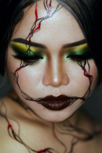 Woman wearing SFX makeup on her face.
